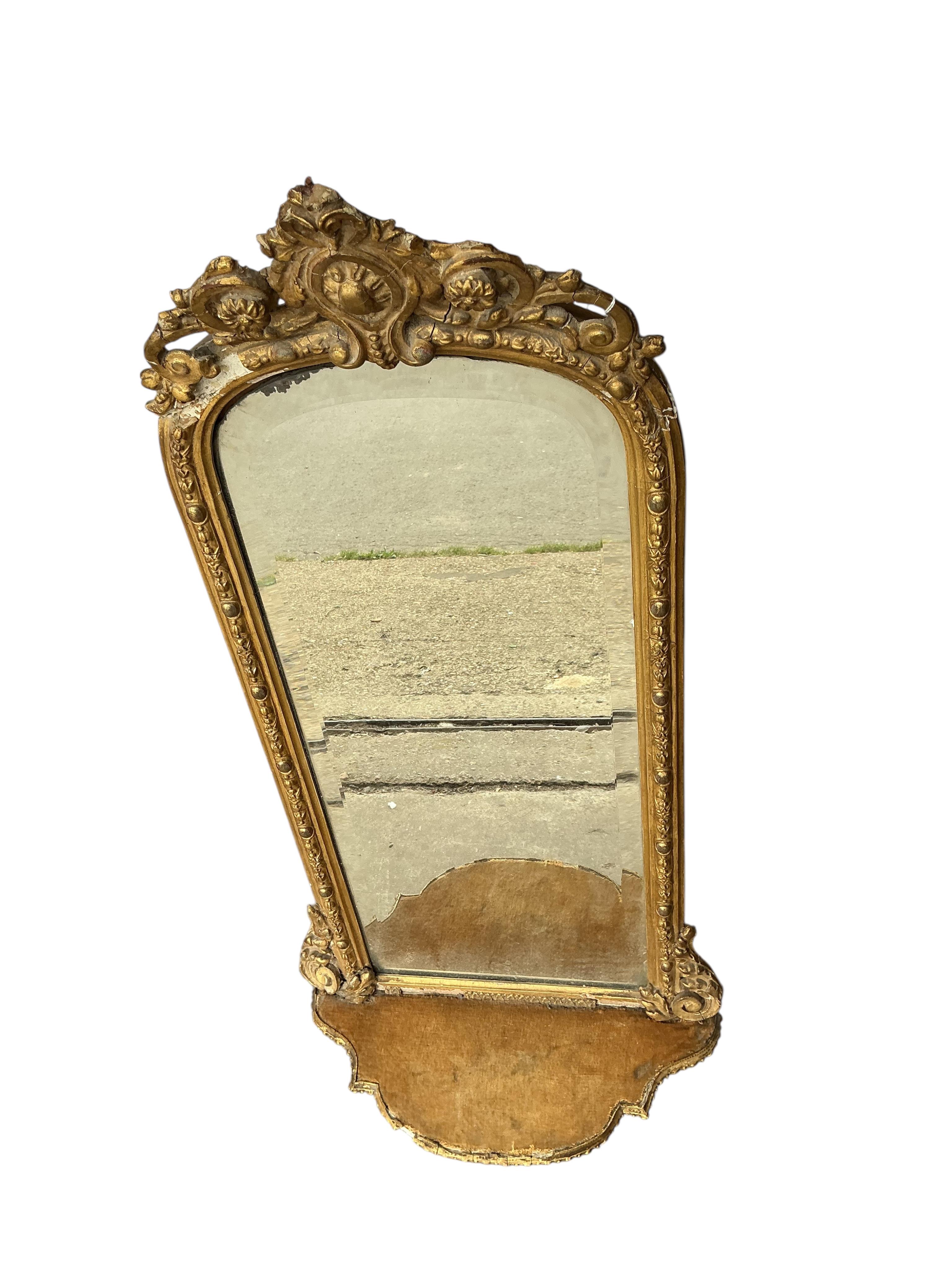 A Victorian giltwood and composition wall mirror, width 38cm, height 96cm, some damage